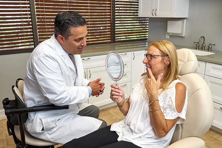 Dr. Alegre in a consultation with a patient.