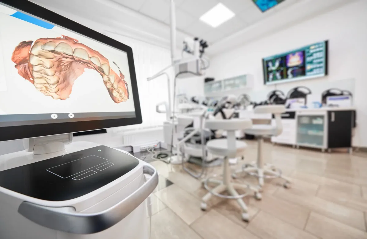 A 3D dental scan of teeth and jaw displayed on a computer screen